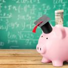a piggy bank wearing a graduation cap