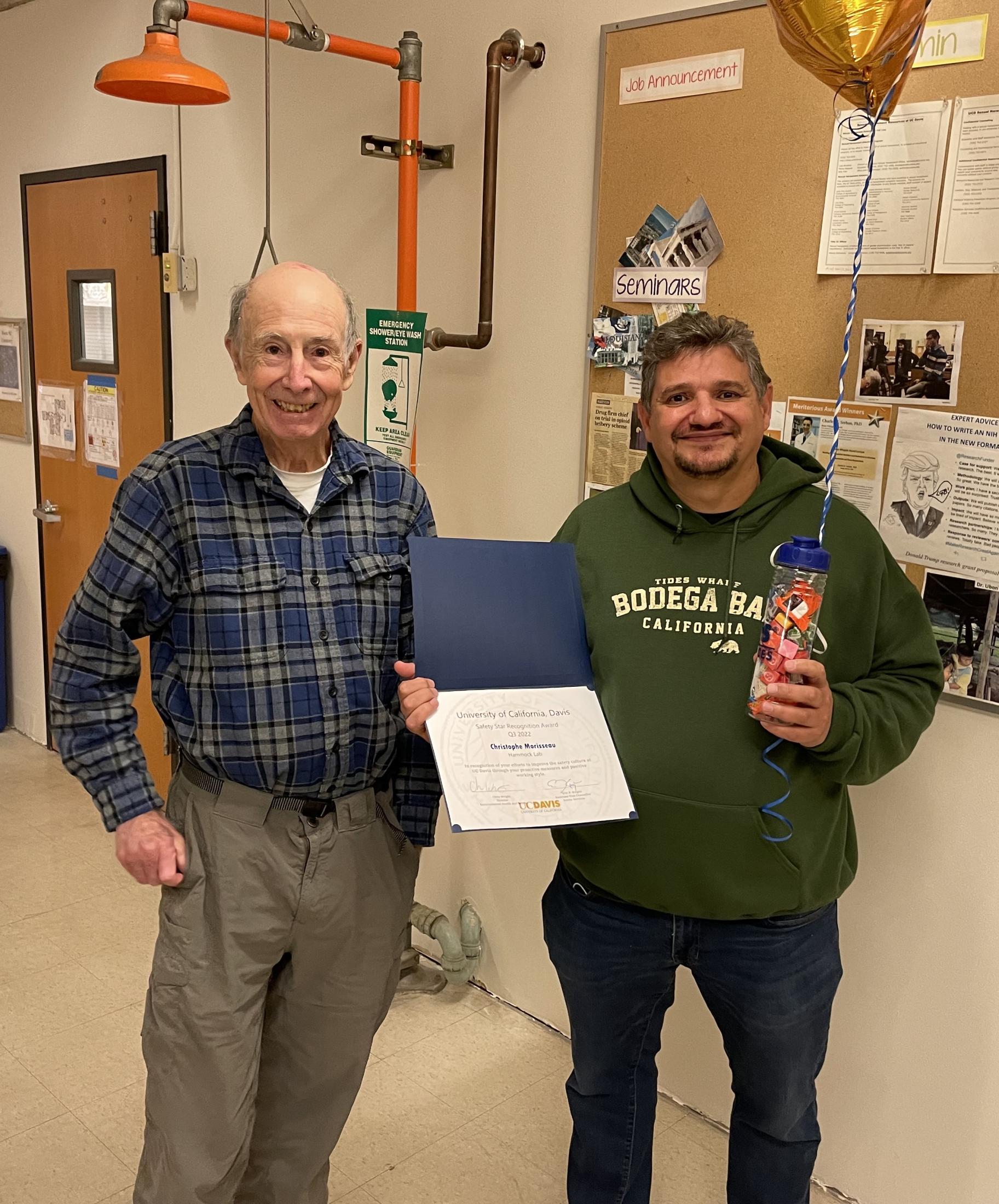 man holds balloon and safety star certificate