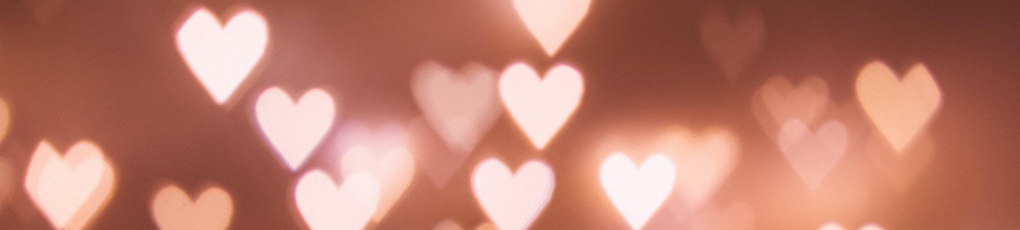 many pink and white hearts glowing