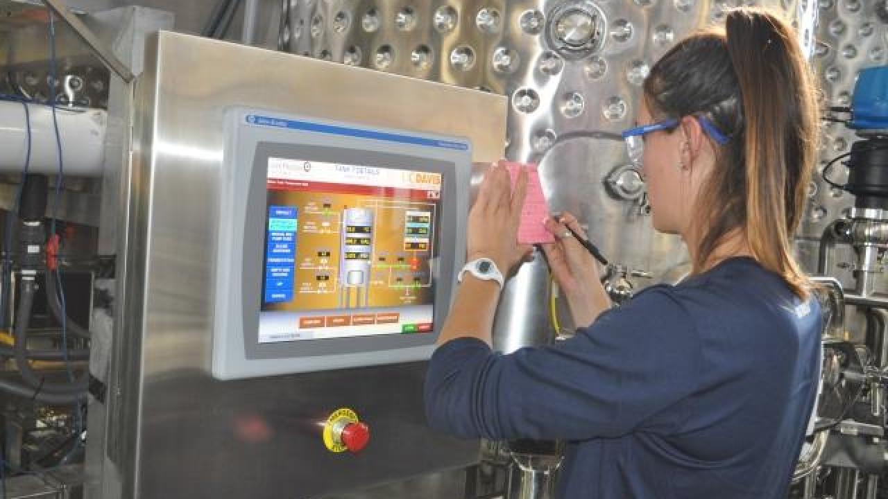 student working in enology lab.