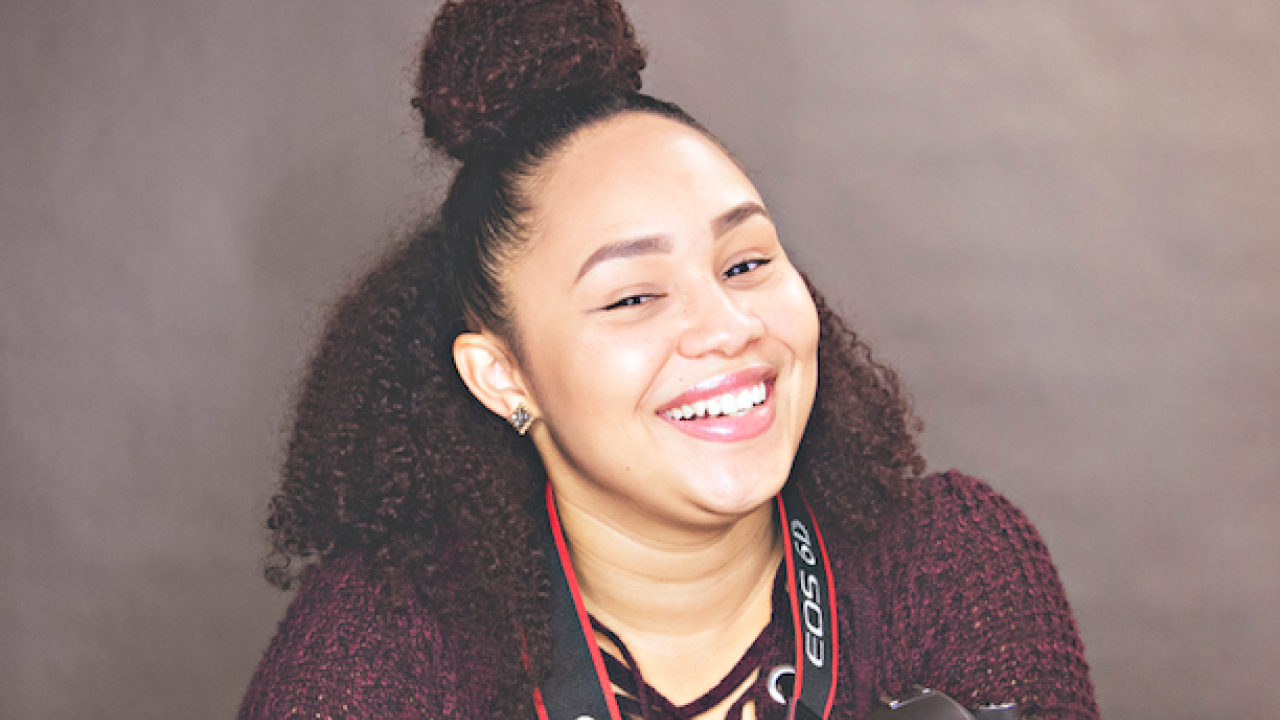 Zina Austin Zina Austin smiling with her camera