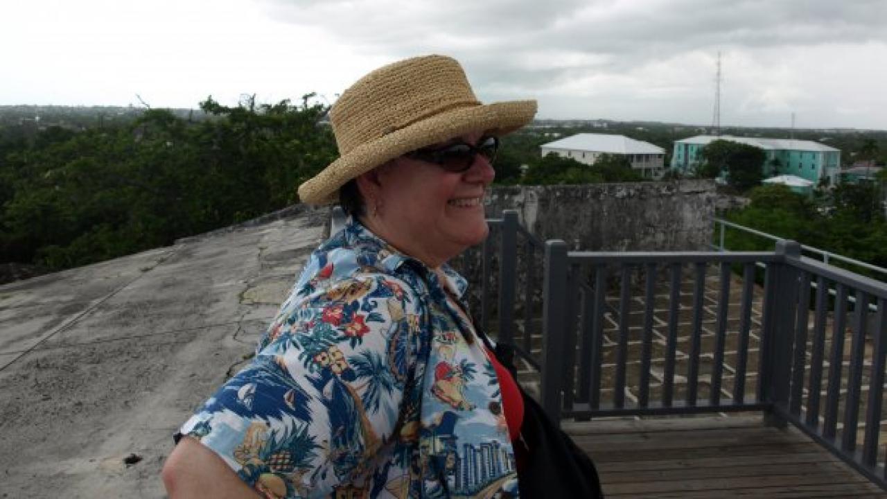 Debbie in a floral shirt happy in the Bahamas. 