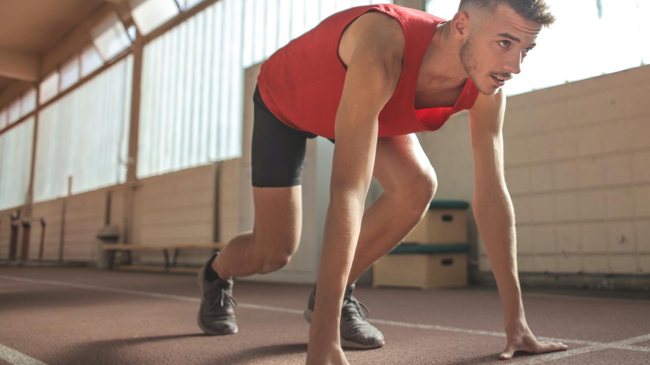 man getting ready to start running