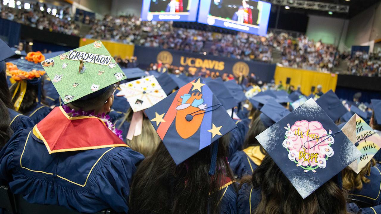 Image of student graduation caps at a ceremony