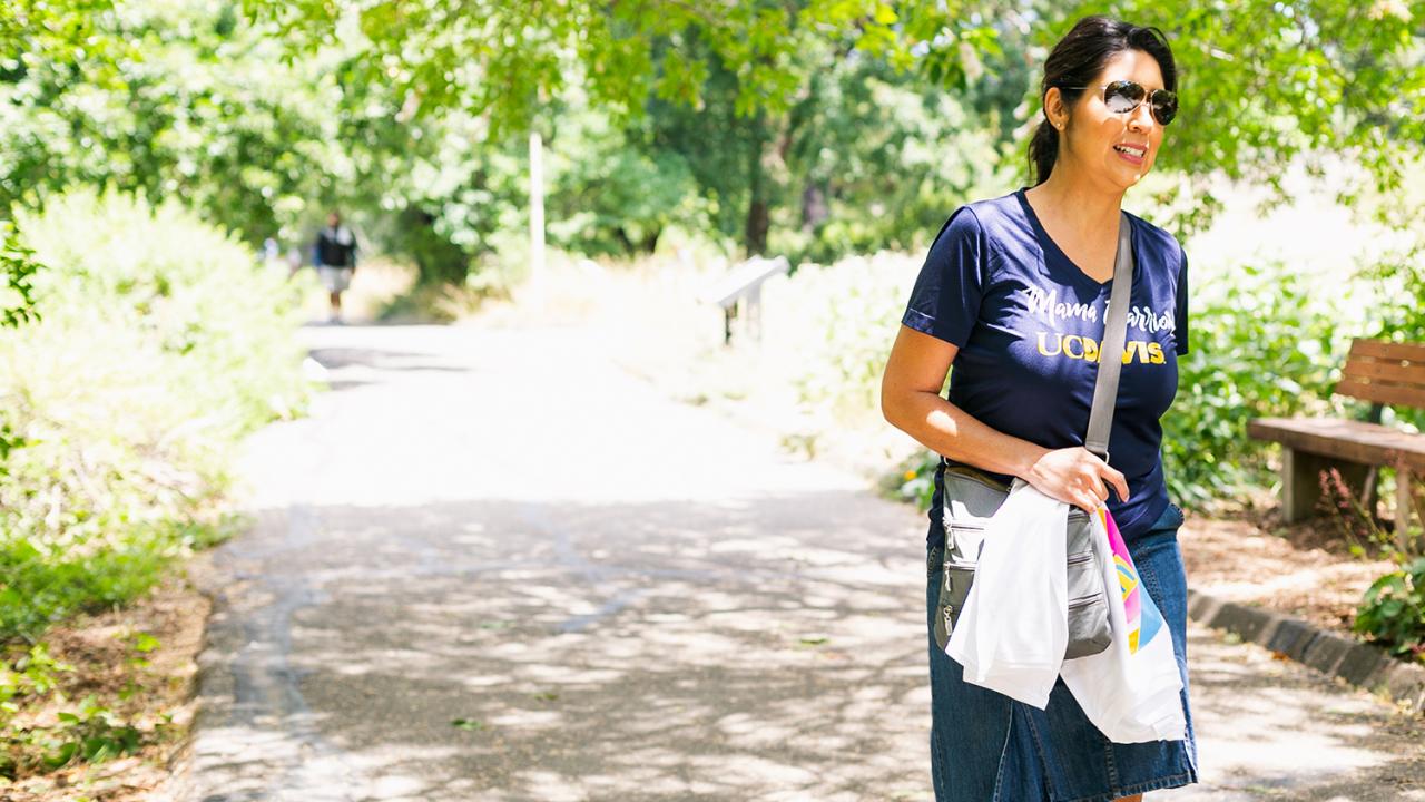 woman walking through the uc davis arboretum