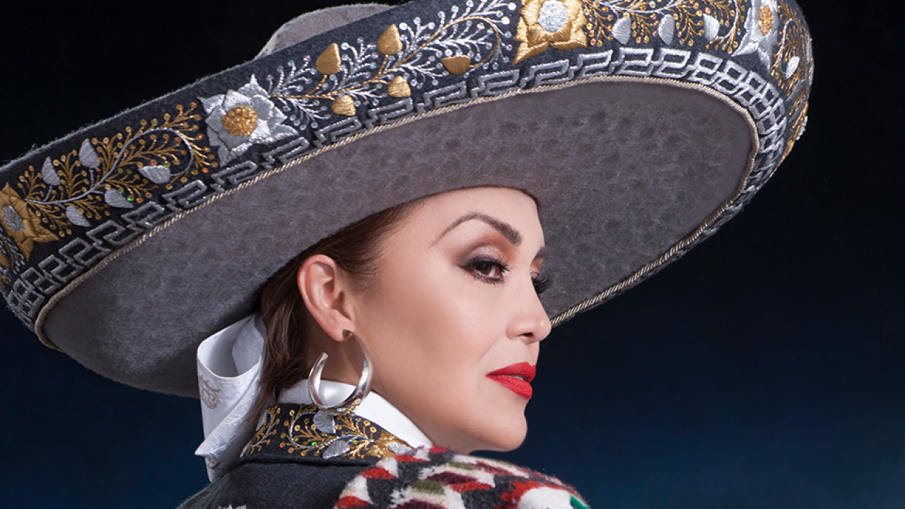 a closeup of Aida Cuevas wearing traditional mariachi clothing