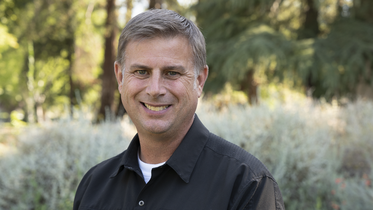tim annis, fire marshal, smiling at camera.