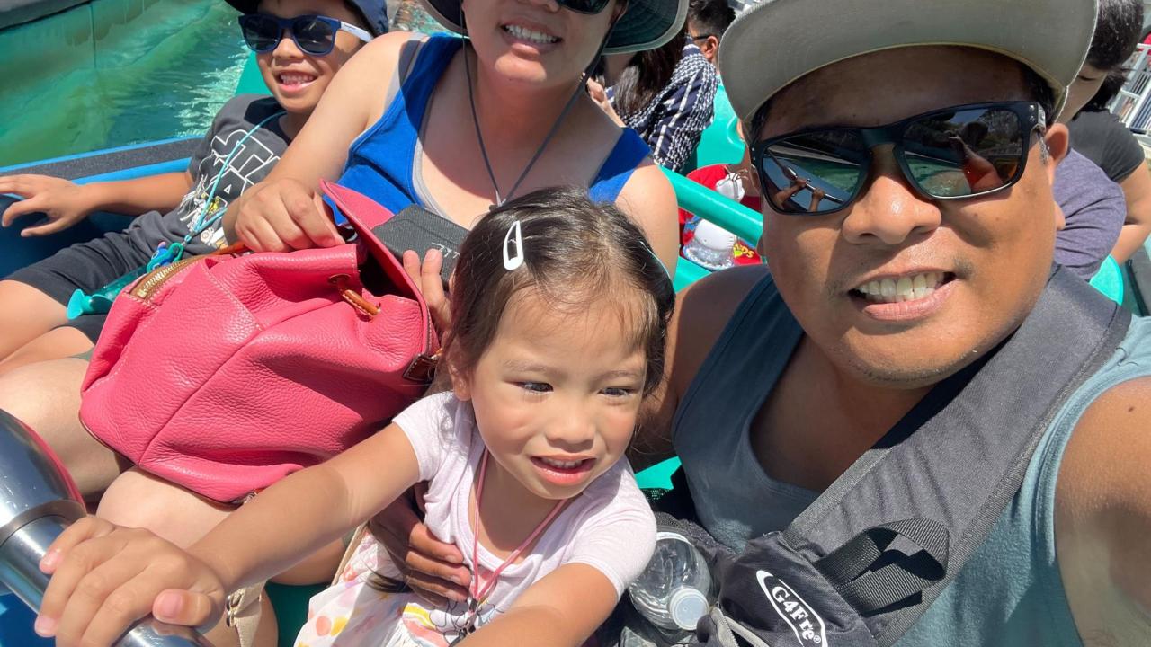 A selfie of a happy family at the themed park.