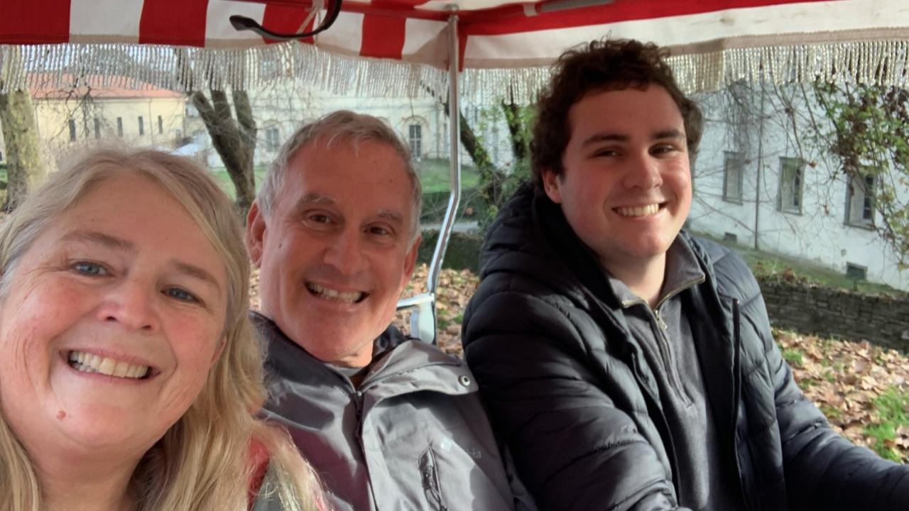 Professor Bain, her husband, and her son on a bike ride in Italy.