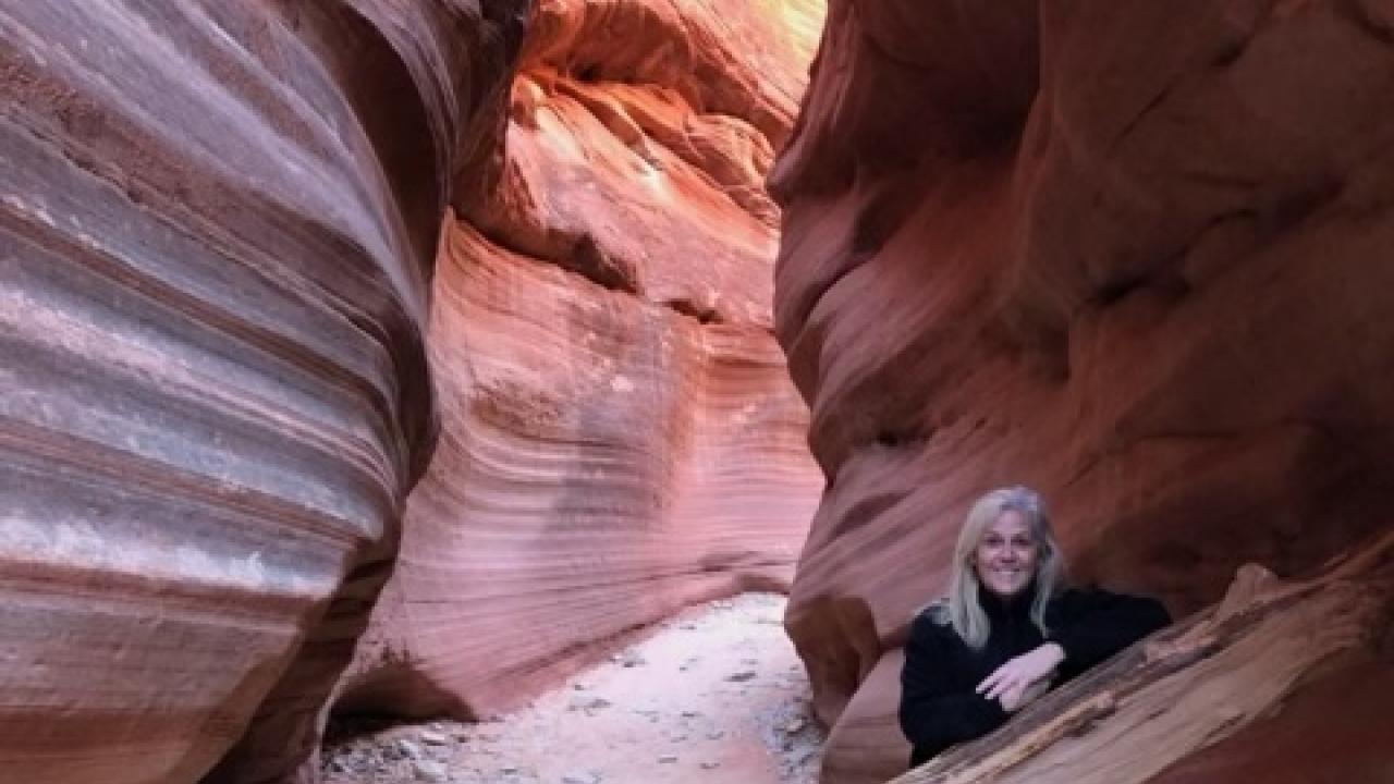 leslie poses in a canyon