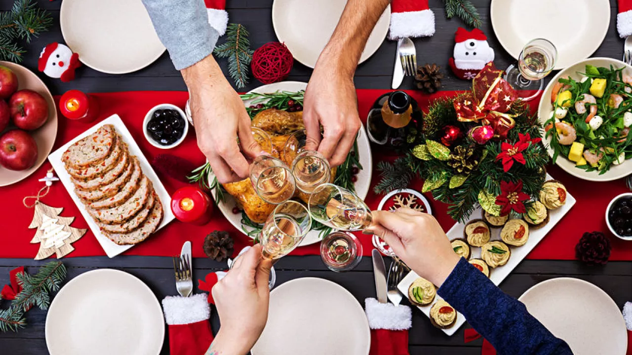 people gather to enjoy some holiday food 