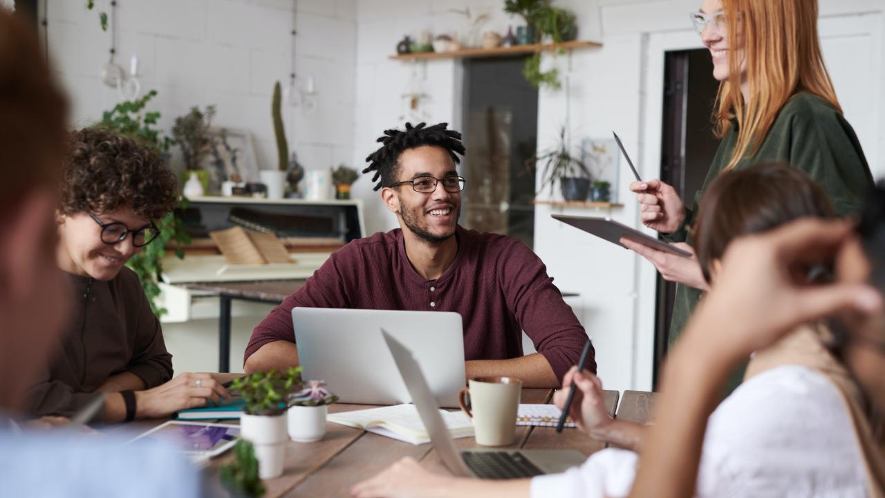 a group of coworkers at a table collaborating