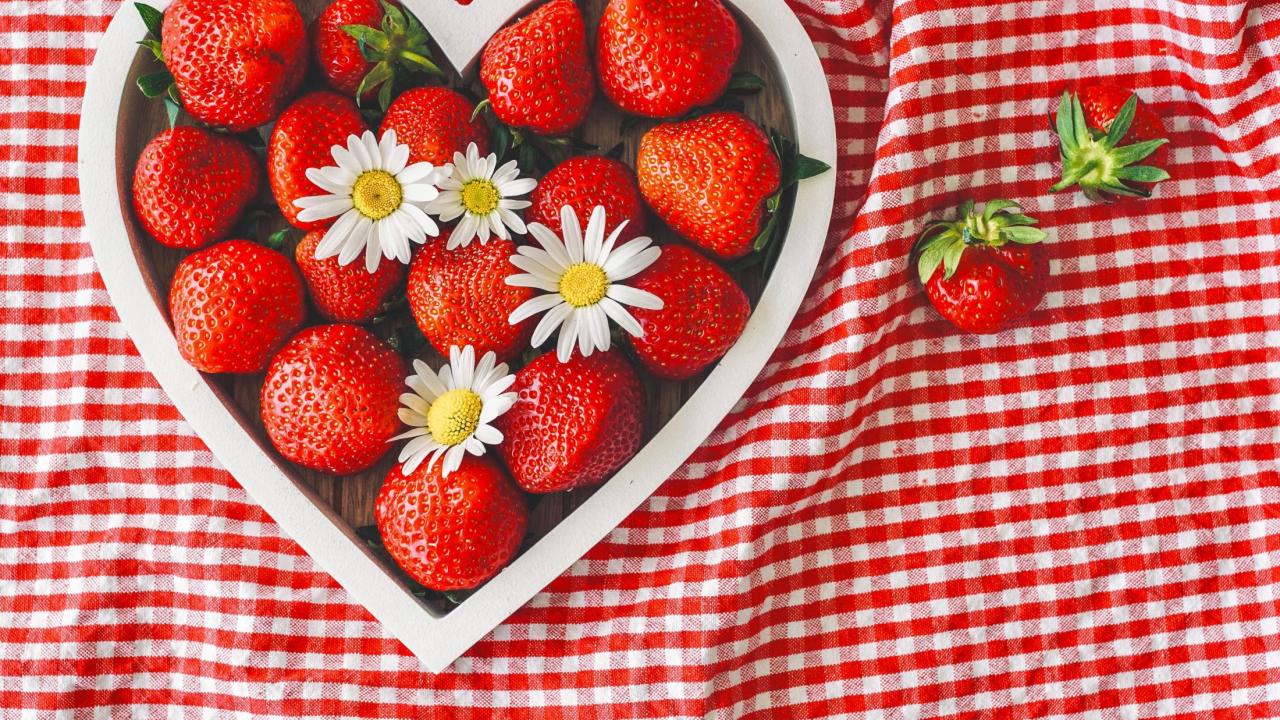 Heart dish filled with strawberries