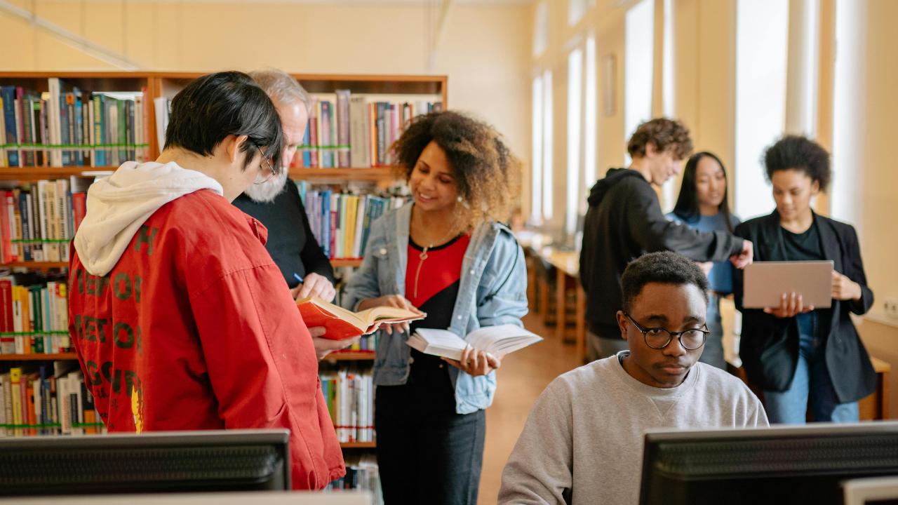 Students in discussion in a library