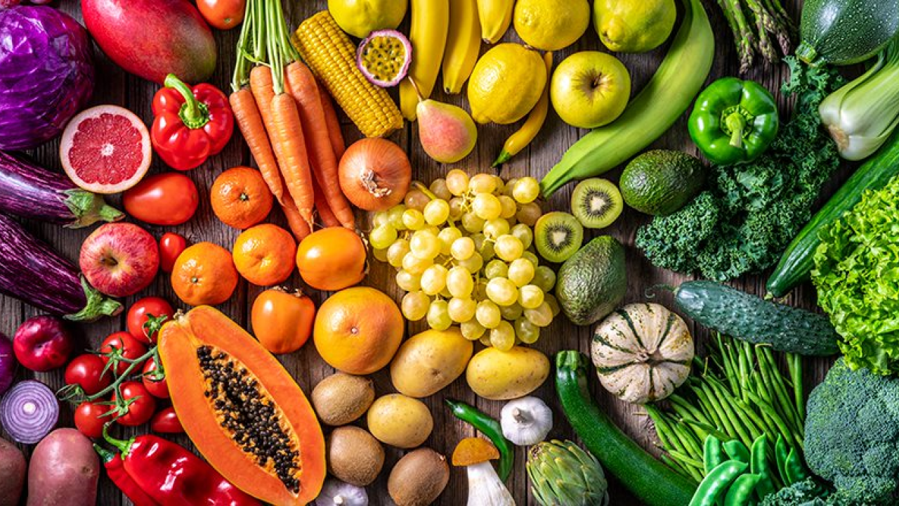 a table of rainbow foods laid out on a table