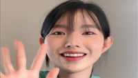 A thumbnail of Dabin smiling and waving her hand