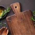 Wooden Chopping Board and Herbs