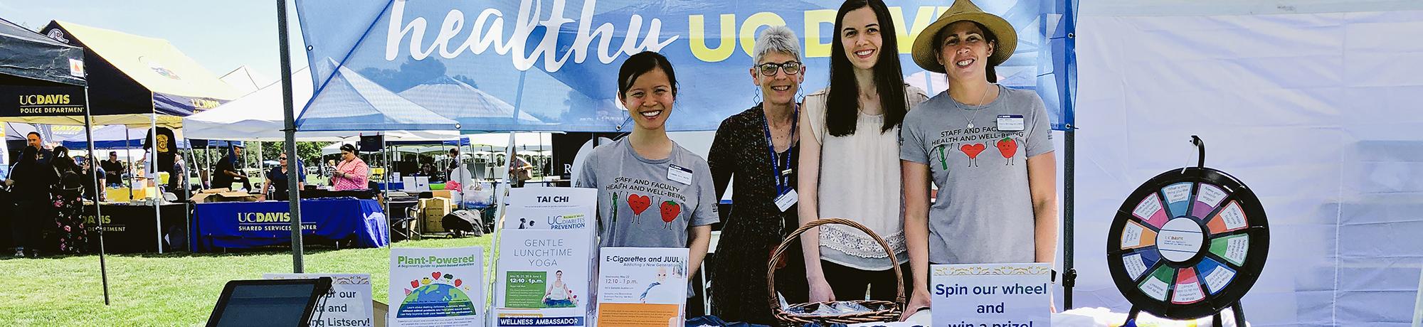 staff and faculty health and well-being team at a wellness fair uc davis